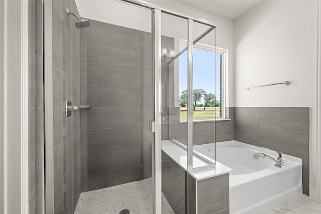 313 Slimp Blf, Azle, TX 76020 - bathroom with a stall shower, a garden tub, and marble look tile flooring