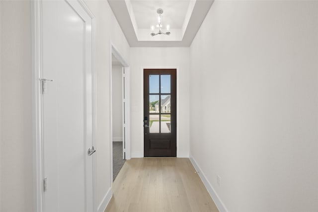 313 Slimp Blf, Azle, TX 76020 - entryway with a chandelier, light wood-type flooring, and a raised ceiling