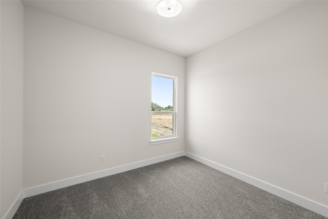 313 Slimp Blf, Azle, TX 76020 - spare room featuring baseboards and dark colored carpet