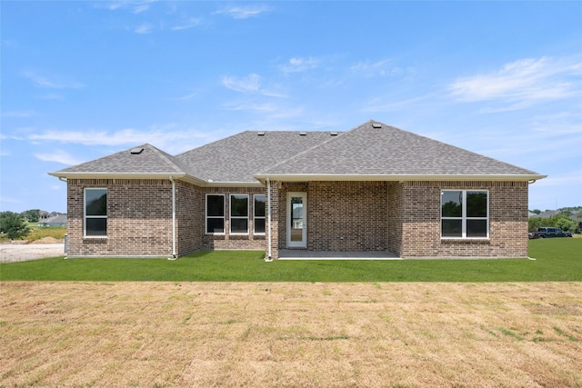 313 Slimp Blf, Azle, TX 76020 - rear view of property featuring a patio, roof with shingles, brick siding, and a lawn