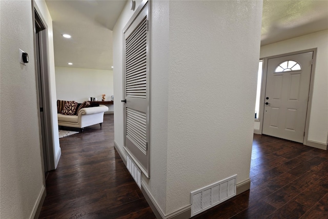 hallway with dark hardwood / wood-style floors