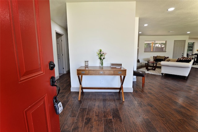 entrance foyer with dark hardwood / wood-style floors