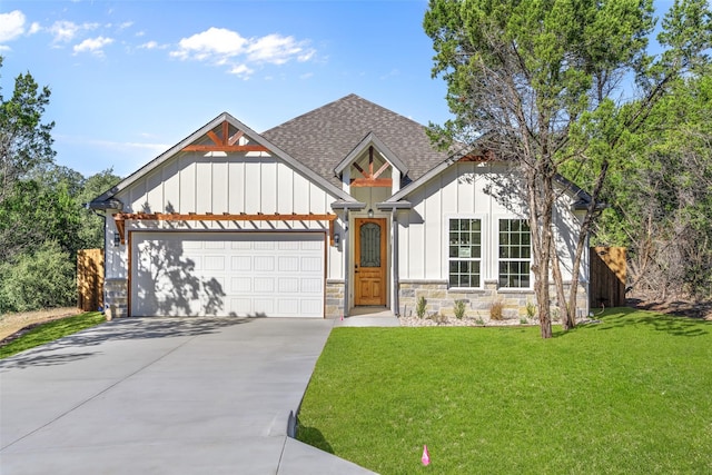 view of front of house with a garage and a front yard