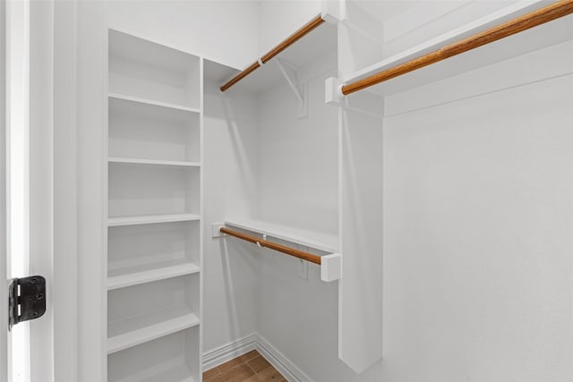 spacious closet featuring hardwood / wood-style flooring