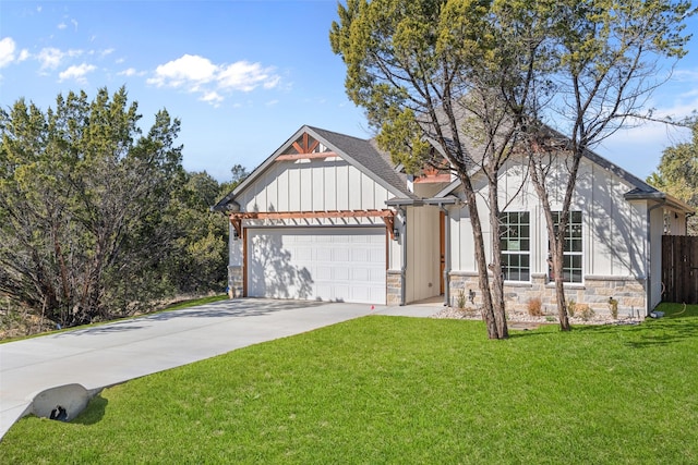 view of front of house with a front yard and a garage