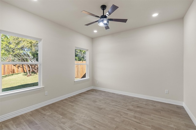 unfurnished room featuring ceiling fan and light hardwood / wood-style floors