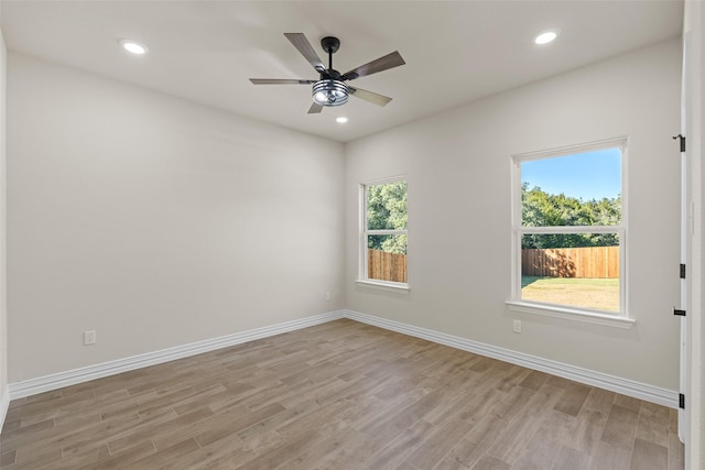 empty room featuring light hardwood / wood-style flooring and ceiling fan