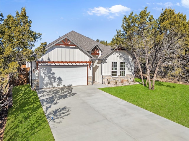 view of front facade with a garage and a front lawn