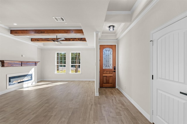 foyer entrance with beam ceiling, ceiling fan, ornamental molding, and light wood-type flooring