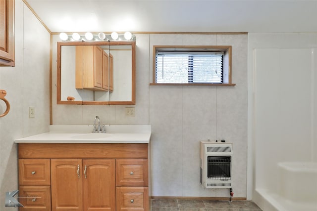 bathroom with heating unit and vanity