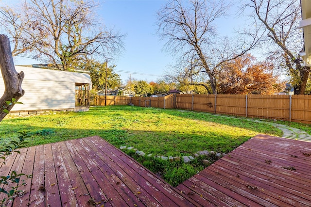 wooden terrace with a yard