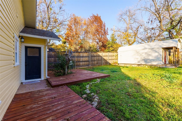 view of yard with an outbuilding and a deck