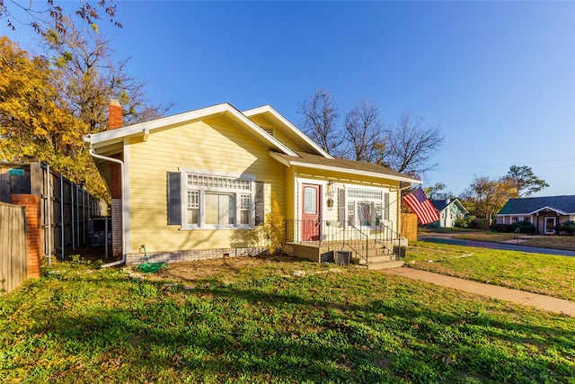 bungalow with a front lawn