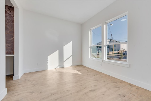 empty room with light wood-type flooring