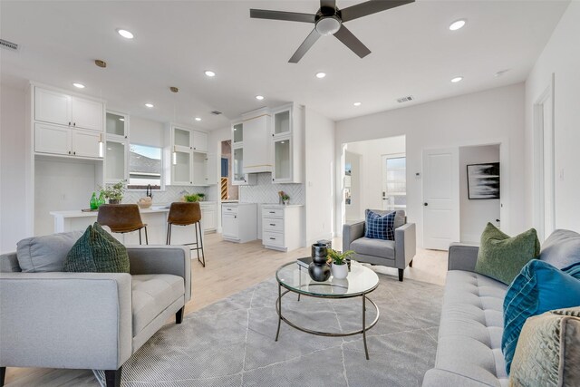 3919 Furey St, Dallas, TX 75212 - living room with a ceiling fan, light wood-type flooring, and recessed lighting