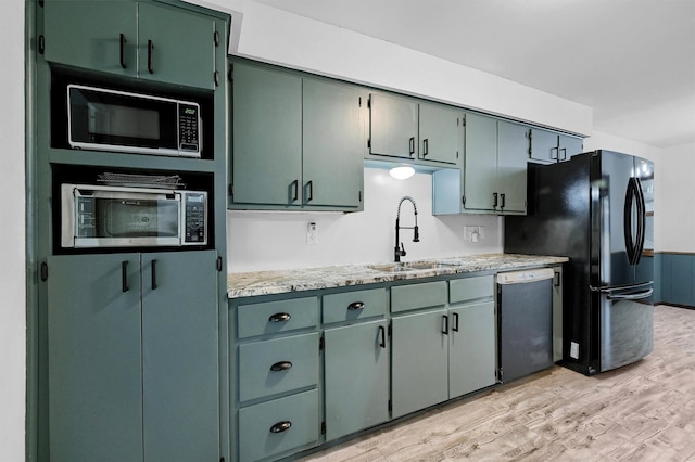 1802 Oak Creek Dr, Sherman, TX 75092 - kitchen featuring black appliances and light wood finished floors