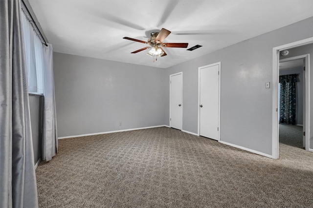 1802 Oak Creek Dr, Sherman, TX 75092 - unfurnished bedroom featuring carpet flooring, two closets, and a ceiling fan