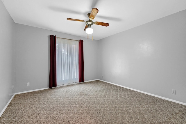 empty room featuring ceiling fan and carpet floors