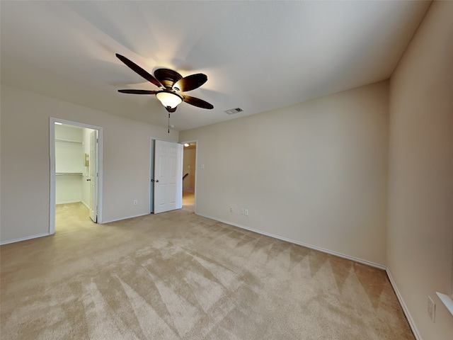 4133 Kyndra Cir, Richardson, TX 75082 - unfurnished bedroom featuring light colored carpet, visible vents, a spacious closet, and baseboards