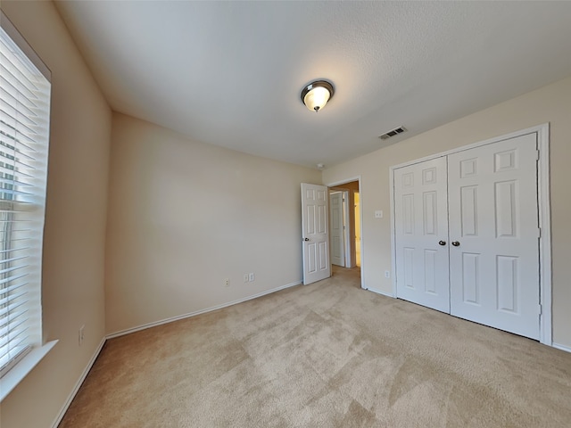 4133 Kyndra Cir, Richardson, TX 75082 - unfurnished bedroom with baseboards, visible vents, a closet, and carpet flooring