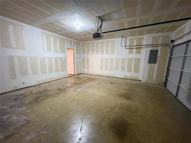 garage featuring electric panel and a garage door opener