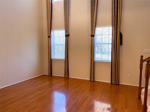 spare room with hardwood / wood-style floors