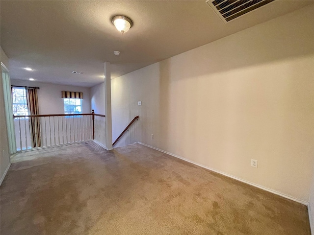 unfurnished room featuring carpet flooring