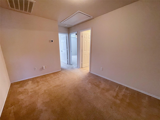 unfurnished room with light colored carpet