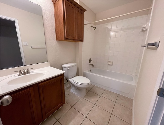 full bathroom featuring tile patterned floors, vanity, toilet, and tiled shower / bath