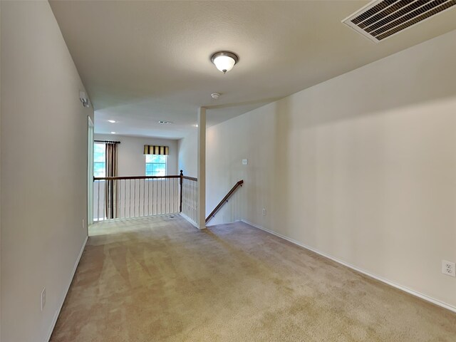 4133 Kyndra Cir, Richardson, TX 75082 - unfurnished room with light colored carpet, visible vents, and baseboards