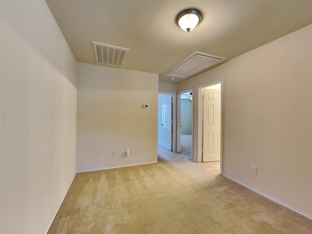 4133 Kyndra Cir, Richardson, TX 75082 - spare room with attic access, visible vents, light colored carpet, and baseboards