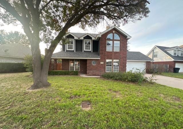 front facade with a front lawn