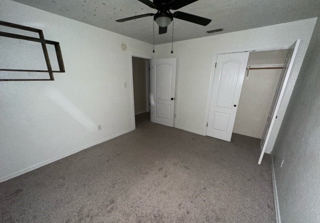 unfurnished bedroom with carpet flooring and ceiling fan