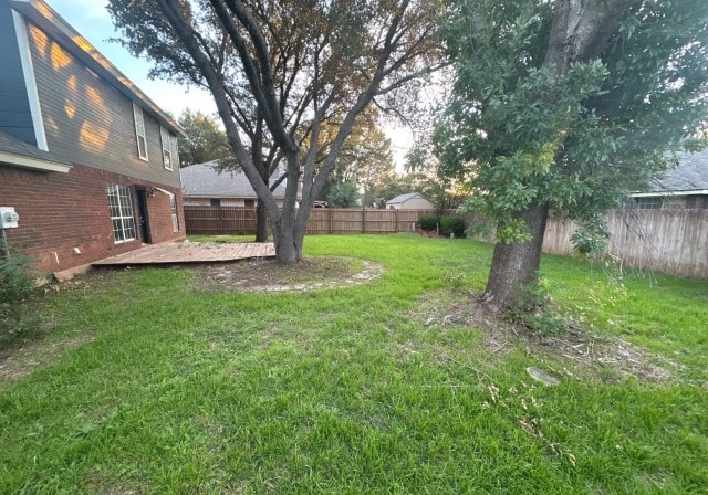 view of yard with a wooden deck