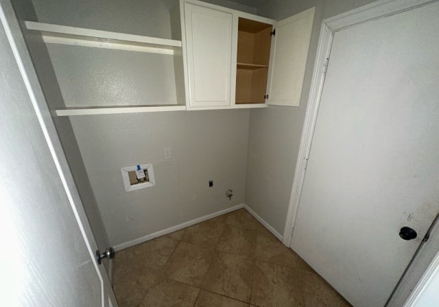 washroom featuring hookup for an electric dryer, hookup for a washing machine, gas dryer hookup, and cabinets