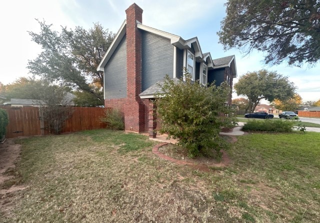 view of home's exterior featuring a lawn