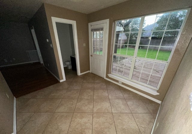 doorway to outside featuring light tile patterned floors