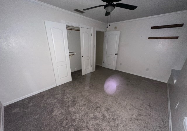 unfurnished bedroom featuring a textured ceiling, a closet, ceiling fan, and ornamental molding