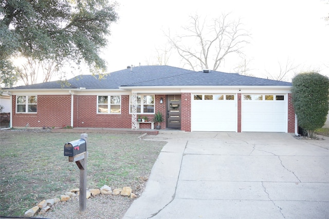 ranch-style house with a front yard and a garage