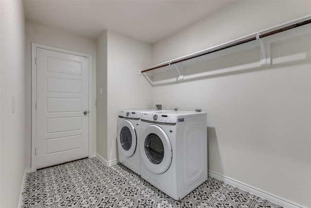 washroom featuring washer and clothes dryer