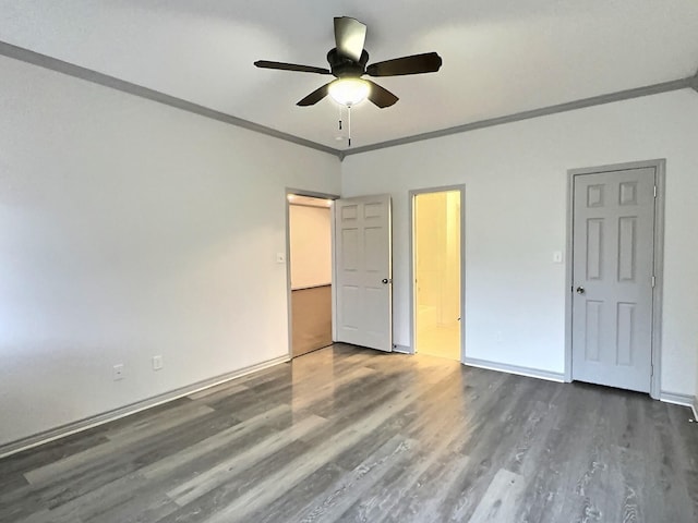 unfurnished bedroom featuring crown molding, ceiling fan, and dark hardwood / wood-style floors