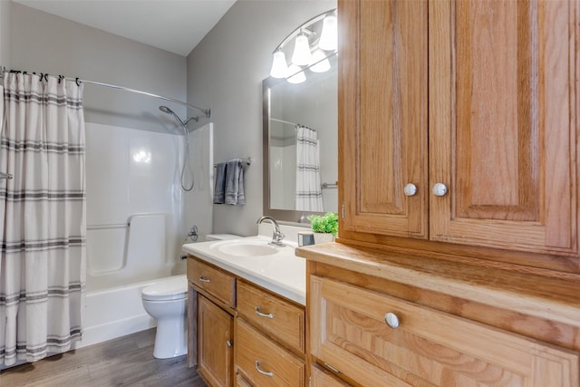 full bathroom featuring shower / bath combination with curtain, vanity, hardwood / wood-style flooring, and toilet