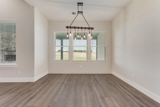 unfurnished dining area with hardwood / wood-style flooring