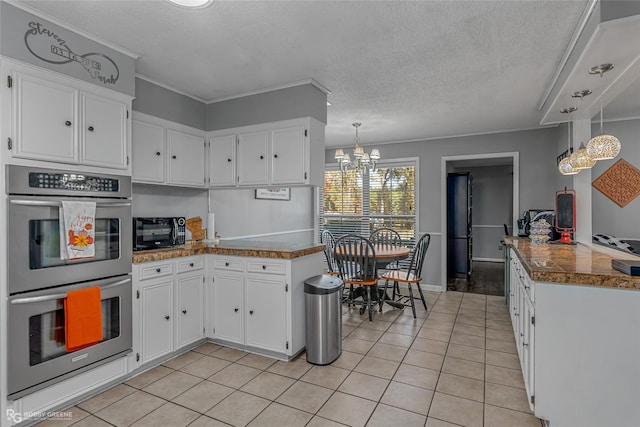 kitchen with white cabinetry, decorative light fixtures, light tile patterned floors, kitchen peninsula, and double oven