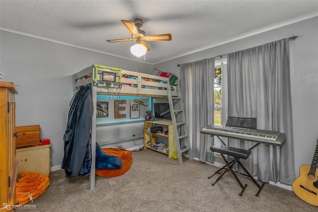 bedroom with ceiling fan, ornamental molding, a textured ceiling, and carpet