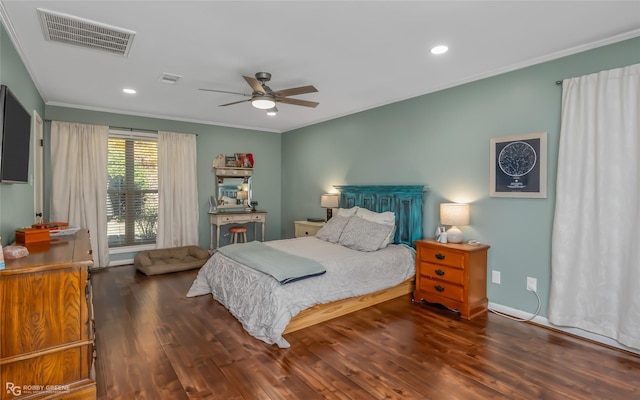 bedroom featuring ornamental molding, dark wood-type flooring, and ceiling fan