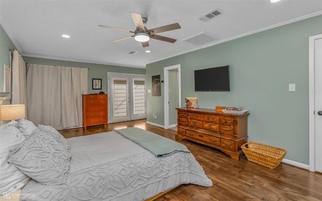 bedroom with crown molding, dark wood-type flooring, french doors, and ceiling fan