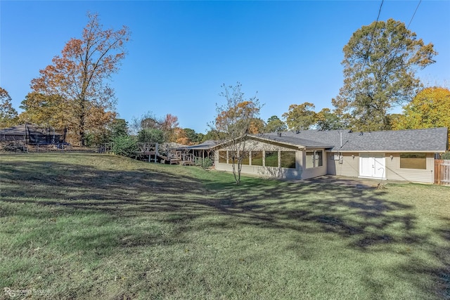 back of house with a yard