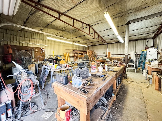 garage featuring metal wall and a workshop area