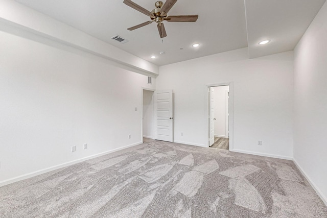 unfurnished room with light carpet and ceiling fan